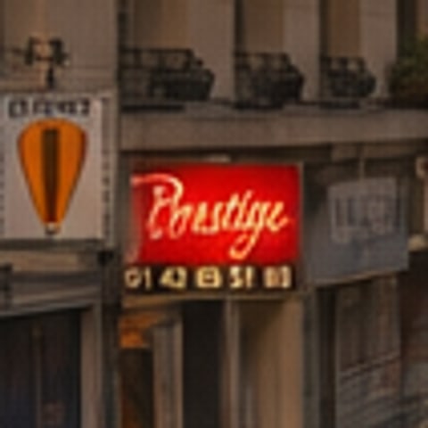 The same sign in the model's version, with different lettering and a phone number that no longer matches.